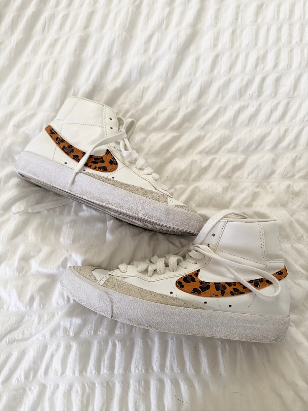 Nike White High-Top Sneakers with Leopard Swoosh